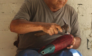 A cobbler fixing the shoes