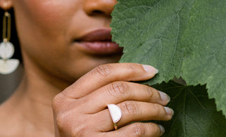 A woman holding a leaf