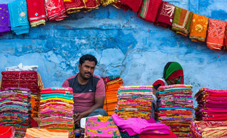 A person selling different cloths