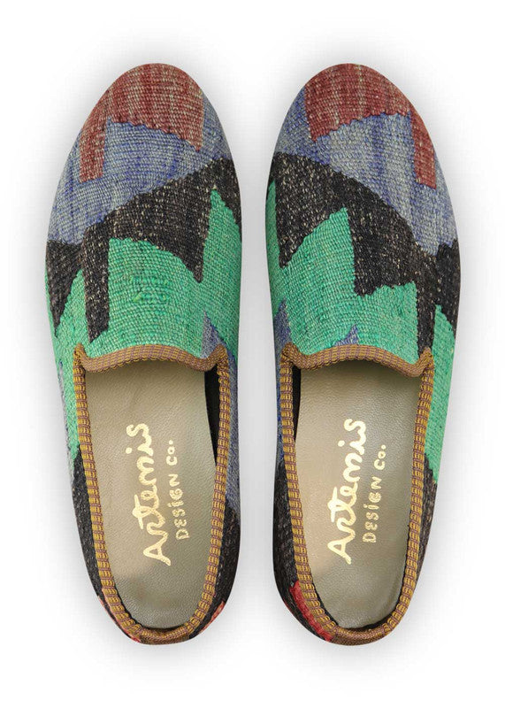 Artemis Design Co. Men's Loafers present a dynamic color palette, featuring bold shades of red, blue, black, green, and red-orange. Meticulously crafted, these loafers offer a striking balance of style and versatility. Whether for casual outings or formal occasions, they make a confident statement with every step. (Front View)