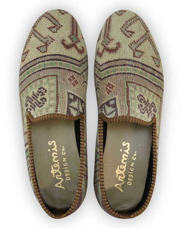 The Artemis Men's Loafers blend a palette of earthy elegance, featuring tones of brown, beige, khaki, white, blue, and peach. These loafers seamlessly combine the warmth of brown and beige with the lightness of khaki and white, enhanced by subtle touches of calming blue and soft peach. (Front View)