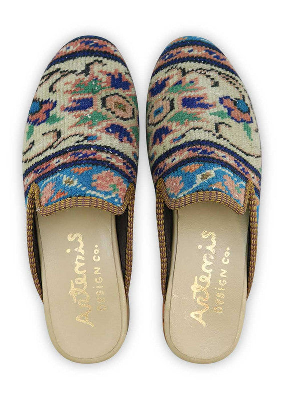 The Artemis Men's Slippers showcase a unique color combination of khaki, pink, black, green, and dark blue. These slippers offer a playful mix of earthy and vibrant tones, creating a stylish and eye-catching look. (Front View)
