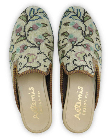 The Artemis Men's Slippers showcase an earthy and soothing color combination of khaki, green, brown, lilac, and blue. These slippers offer a harmonious blend of natural and cool tones, creating a comfortable and stylish look.  (Front View)