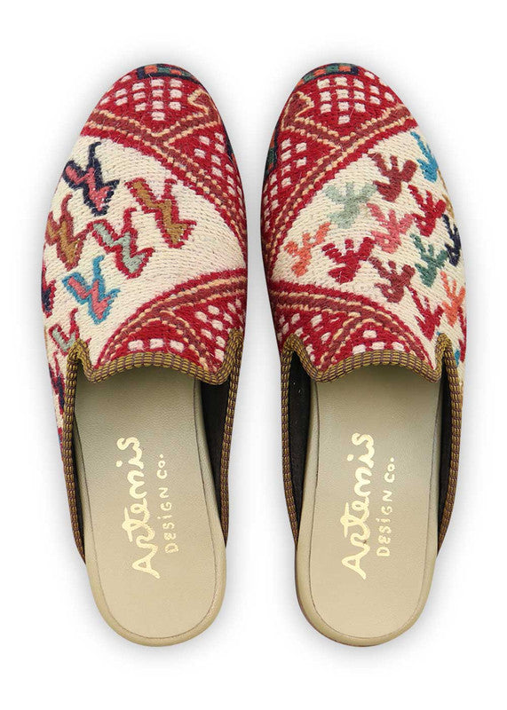 Artemis Design & Co introduces Men's Slippers that embody a vibrant spectrum of colors, including red, white, green, peach, blue, orange, brown, and teal. Elevate your comfort with these stylish and diverse slippers, carefully crafted to bring a touch of flair to your loungewear. (Front View)