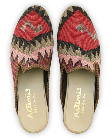 Artemis Design & Co presents stylish Men's Slippers in a sophisticated color palette, featuring a blend of maroon, black, pink, khaki, and red. Crafted with precision and comfort in mind, these slippers seamlessly combine fashion and functionality, offering a luxurious and trendy footwear option for the modern man. (Front View)